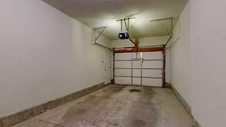 a tandem garage with overhead lights