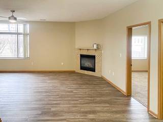a living room with a fireplace and luxury vinyl hardwood flooring