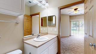 a bathroom with a vanity sink, overhead lighting, a medicine cabinet, and a mirror