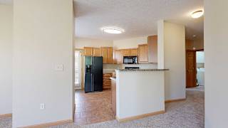 a kitchen with a black refrigerator and a counter top
