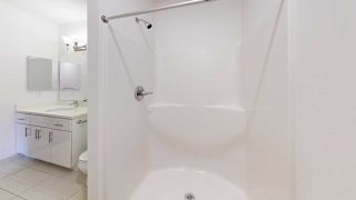 a bathroom with a walk-in shower