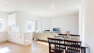 Furnished apartment dining area with small kitchen table