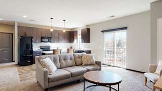 Furnished apartment living area with sofa and coffee table