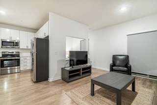 Studio apartment for rent with view of living room and kitchen in contemporary design near UNMC Omaha