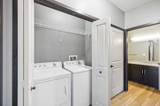 A white washer and dryer in a small laundry room.