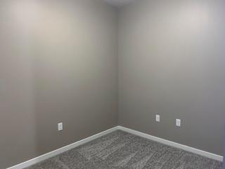 Small bedroom in the Plum studio apartment at the flats at shadow creek
