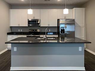 Living and dining area leading into the kitchen in the buffalo floorplan at the flats at shadow creek in the buffalo floorplan at the flats at shadow creek