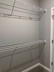 Walk in closet with ample shelving and hanging space in the buffalo floorplan