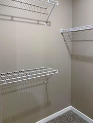 Walk in closet with plenty of shelving and hanging space