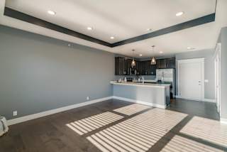 A spacious kitchen with a bar area and a large island.