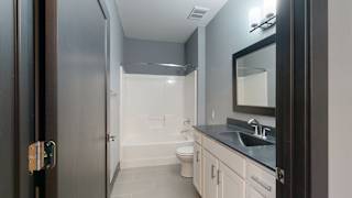 a bathroom with a toilet sink and bathtub