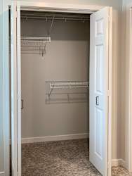 a walk in closet in a 555 waverly unit