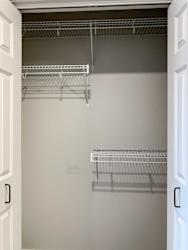 interior of a closet with shelving