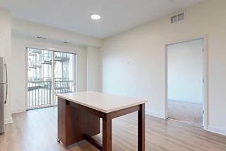 Kitchen and dining area with patio door and moveable island