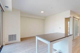 A living room and kitchen with an island