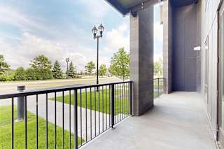 Porch with black metal railing