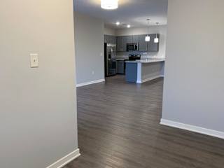 A kitchen area with a countertop and cabinets.