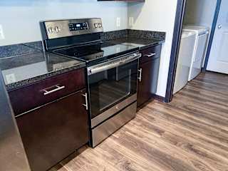 A black stove top oven with a glass door is on a counter.