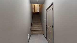 a view from the bottom of the stairs looking up