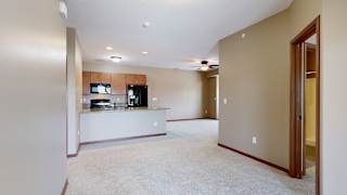 a view of the kitchen and living room from the dining room