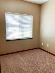 A den space with a large window.