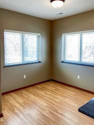 A dining area with windows.