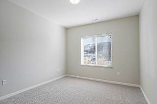 a bedroom with a large window