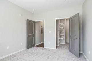a bedroom with an attached walk-in closet