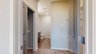 an attached walk-through closet and bathroom