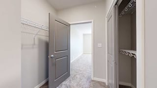 a walk-through closet attached to the primary bedroom