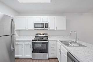 the preserve at ballantyne commons apartment kitchen with stainless steel appliances