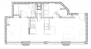 A floor plan of a house with a kitchen, living room, and two bedrooms.