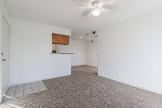 A model unit living room at Skyler Ridge Complex with an open layout and ample space for furniture.