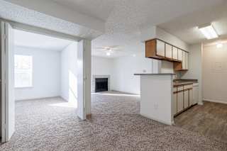 A spacious and versatile living room in a model unit at Skyler Ridge Complex.