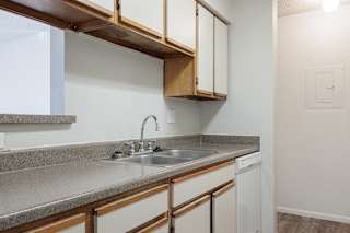 Well-equipped model kitchen at Skyler Ridge featuring black appliances and a clean layout.