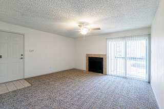 A model unit living room at Skyler Ridge Complex with an open layout and ample space for furniture.