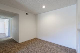 A dining area in a model unit at Skyler Ridge Complex, offering an open space for meals and gatherings.