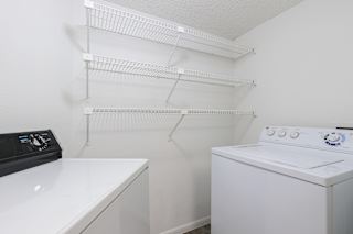 A laundry area in a model unit at Skyler Ridge Complex, featuring a washer & dryer hookups.