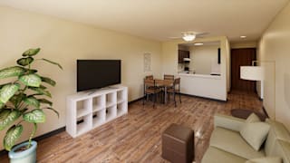 A living room with a brown couch, a white chair, and a television.