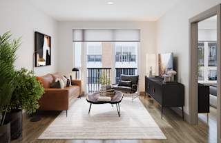 a living room with a couch and a table at Bemiston Place Apartments, Clayton