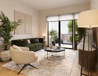 a living room with a couch and a chair and a table at Bemiston Place Apartments, Missouri