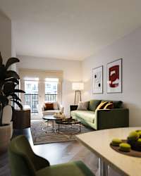 a living room with couches and chairs and a table at The Porter, Maryland Heights