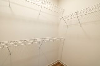 Empty wire shelves in big closet at Timber Club, Missouri, 63304
