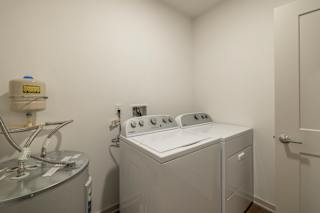 Washing machine in Laundry Room at Timber Club, Missouri, 63304