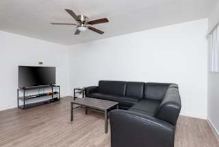 a living room with a couch and a tv