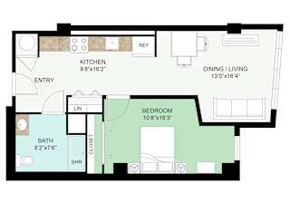 A floor plan of a house with a kitchen, dining/living area, bedroom, bathroom, and entry.