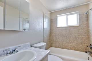 white bathroom with a sink at Kingsbrook Arms, Englewood, Co 80113
