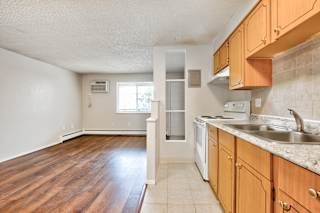 white appliances in kitchen at Kingsbrook Arms, Englewood, Co