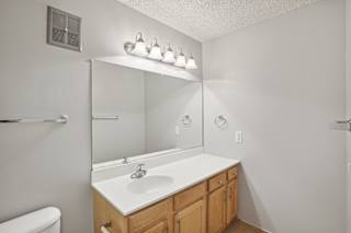 the preserve at ballantyne commons bathroom with sink and mirror