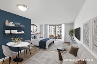 A modern living room with a dining table and chairs.